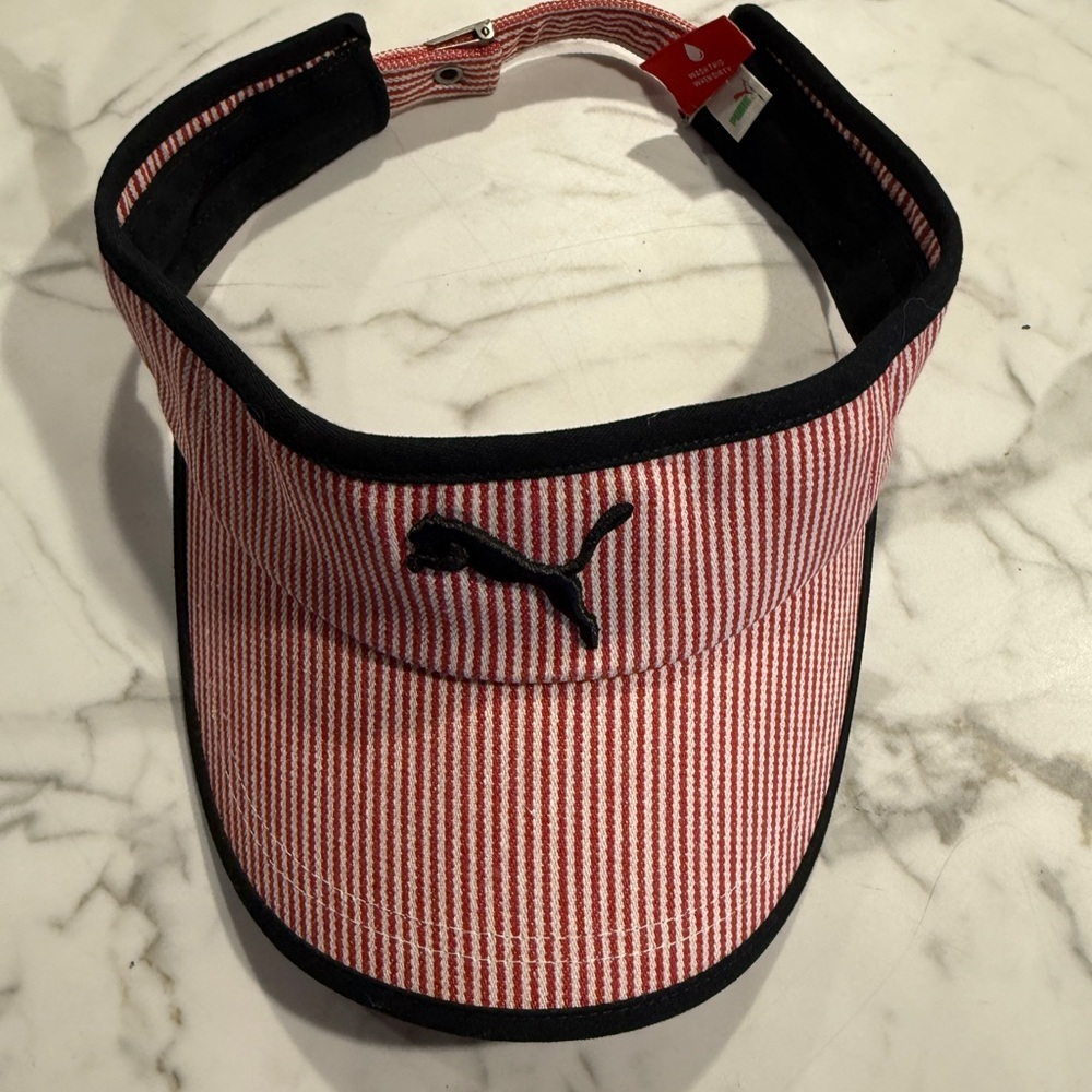 Puma red/pinkish and white striped visor in good used condition